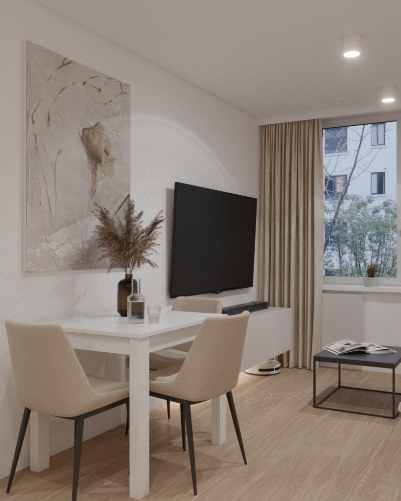 Salon z jadalnią w minimalistycznym stylu, jasnymi krzesłami i dużym telewizorem na ścianie