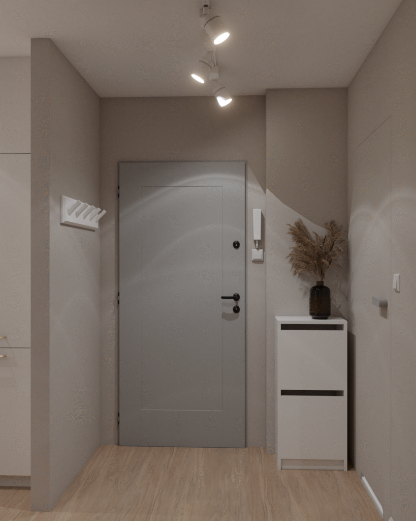 Przedpokój w nowoczesnym stylu z szarymi drzwiami i białą komodą